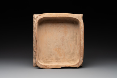 A rare white-glazed stove tile with an alliance coat of arms, Germany or Switzerland, 17th C.