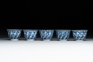 Five Chinese blue and white cups and saucers with floral design, Yu 玉 mark, Kangxi