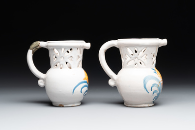 Three French white-glazed and two polychrome puzzle jugs, Nevers, 18th C.