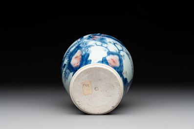 A Chinese blue, white and copper-red 'kylin and phoenix' vase, 19th C.