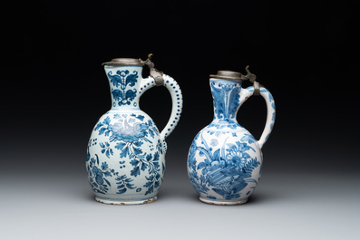 Two Dutch Delft blue and white jugs with pewter lids, 17/18th C.