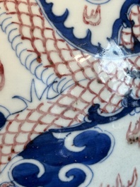A Chinese blue, white and copper-red 'dragon and phoenix' vase, 19th C.