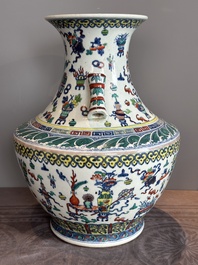 A Chinese doucai 'antiquities' 'hu' vase, Qianlong mark, 19th C.