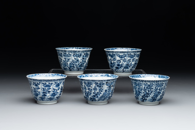 Five Chinese blue and white cups and saucers with floral design, Yu 玉 mark, Kangxi