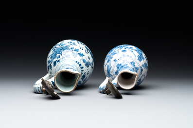 Two Dutch Delft blue and white jugs with pewter lids, 17/18th C.