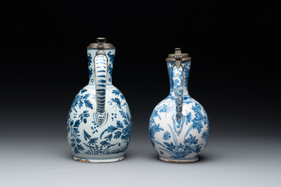 Two Dutch Delft blue and white jugs with pewter lids, 17/18th C.