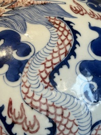 A Chinese blue, white and copper-red 'dragon and phoenix' vase, 19th C.