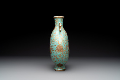 A Chinese gilt-decorated famille rose turquoise 'monkeys' and 'dogs' moon flask, Qianlong mark, 20th C.