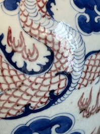 A Chinese blue, white and copper-red 'dragon and phoenix' vase, 19th C.