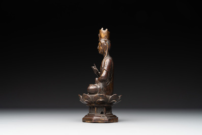 A Chinese bronze seated Guanyin on a lotus throne, probably Liao