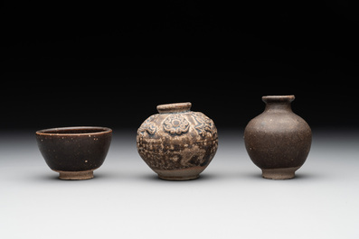 A collection of 11 Chinese and South-East Asian monochrome wares, 15th C. and later