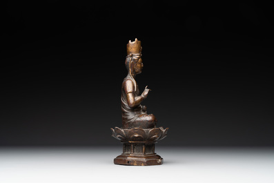 A Chinese bronze seated Guanyin on a lotus throne, probably Liao
