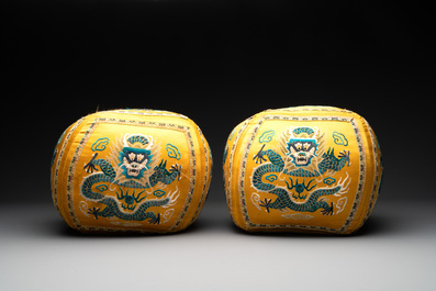 A pair of Chinese yellow-ground embroidered silk 'dragon' cushions, 19th C.