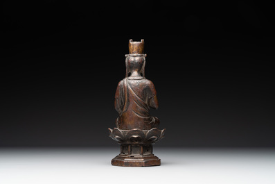 A Chinese bronze seated Guanyin on a lotus throne, probably Liao