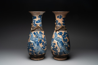 A pair of Chinese Nanking blue and white crackle-glazed 'phoenix' vases, 19th C.