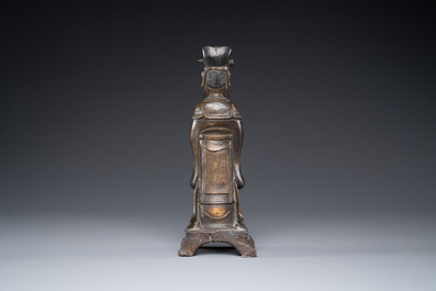 A Chinese bronze figure of an official, Ming