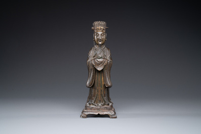 A Chinese bronze figure of an official, Ming