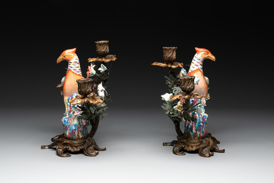 A pair of candle holders mounted with Chinese famille rose models of pheasants, Qianlong