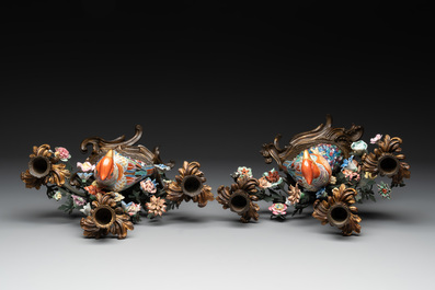 A pair of candle holders mounted with Chinese famille rose models of pheasants, Qianlong