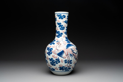 A Chinese blue, white and copper-red 'dragon and phoenix' vase, 19th C.
