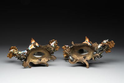 A pair of candle holders mounted with Chinese famille rose models of pheasants, Qianlong