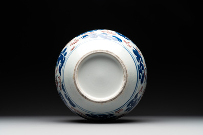 A Chinese blue, white and copper-red 'dragon and phoenix' vase, 19th C.