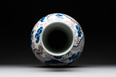 A Chinese blue, white and copper-red 'dragon and phoenix' vase, 19th C.