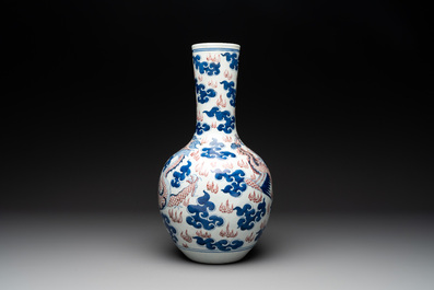 A Chinese blue, white and copper-red 'dragon and phoenix' vase, 19th C.