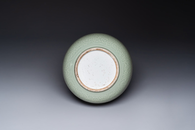 A Chinese incised celadon-glazed bowl with chilong and floral design, Kangxi