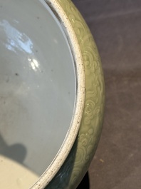 A Chinese incised celadon-glazed bowl with chilong and floral design, Kangxi
