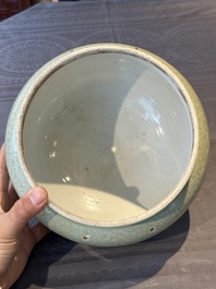 A Chinese incised celadon-glazed bowl with chilong and floral design, Kangxi