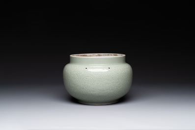 A Chinese incised celadon-glazed bowl with chilong and floral design, Kangxi