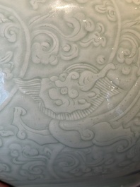 A Chinese incised celadon-glazed bowl with chilong and floral design, Kangxi
