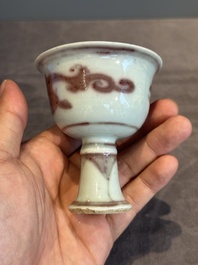 A Chinese copper-red and white 'chilong' stem cup, Ming