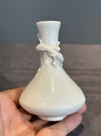 A small Chinese Dehua blanc de Chine 'dragon' bottle vase, Kangxi