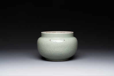 A Chinese incised celadon-glazed bowl with chilong and floral design, Kangxi