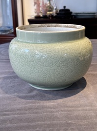A Chinese incised celadon-glazed bowl with chilong and floral design, Kangxi