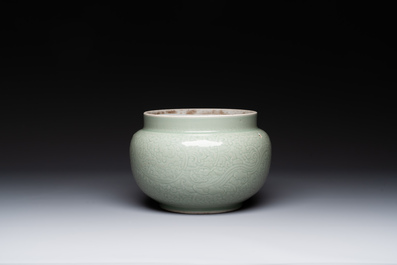 A Chinese incised celadon-glazed bowl with chilong and floral design, Kangxi