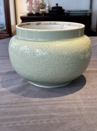 A Chinese incised celadon-glazed bowl with chilong and floral design, Kangxi