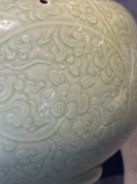 A Chinese incised celadon-glazed bowl with chilong and floral design, Kangxi
