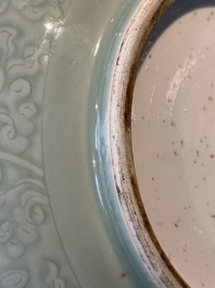 A Chinese incised celadon-glazed bowl with chilong and floral design, Kangxi