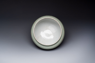 A Chinese incised celadon-glazed bowl with chilong and floral design, Kangxi