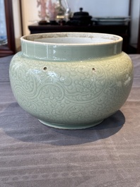 A Chinese incised celadon-glazed bowl with chilong and floral design, Kangxi