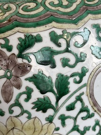 A Chinese famille verte jar with floral design and a wooden cover, Kangxi