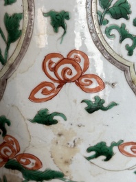 A Chinese famille verte jar with floral design and a wooden cover, Kangxi