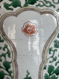 A Chinese famille verte jar with floral design and a wooden cover, Kangxi
