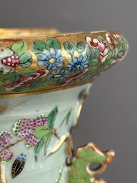 A pair of Chinese Canton famille rose celadon-ground 'court scene' vases, 19th C.