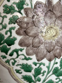 A Chinese famille verte jar with floral design and a wooden cover, Kangxi