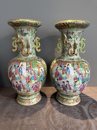 A pair of Chinese Canton famille rose celadon-ground 'court scene' vases, 19th C.