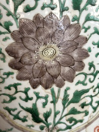 A Chinese famille verte jar with floral design and a wooden cover, Kangxi